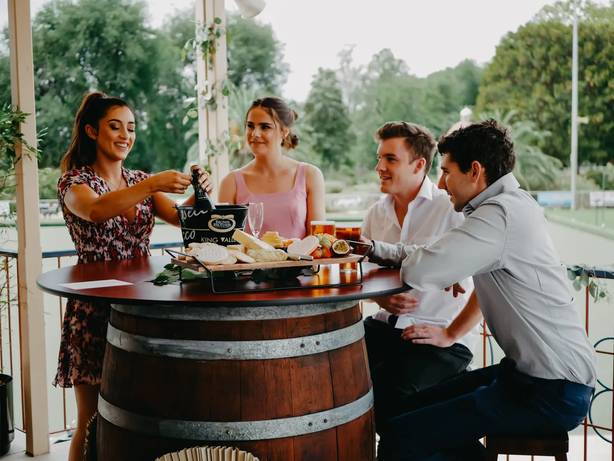 Friends sharing a platter on the balcony at the Benalla Bowls Club