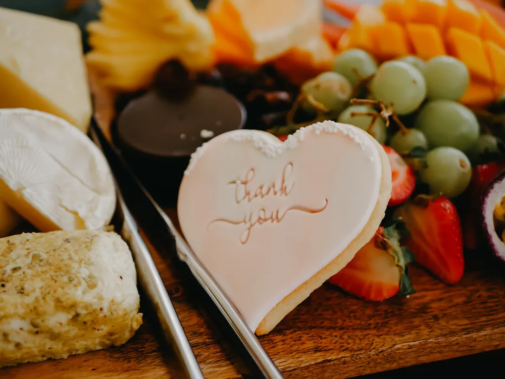 A grazing platter with a thank you biscuit